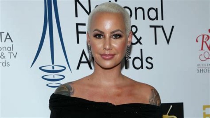 Amber Rose Totally Transforms With New Long Hair Look, Shows Off Face Tattoos