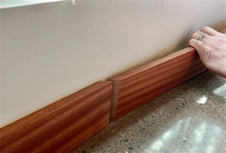 How To Install Baseboard Trim, Even On Crooked Walls (DIY)